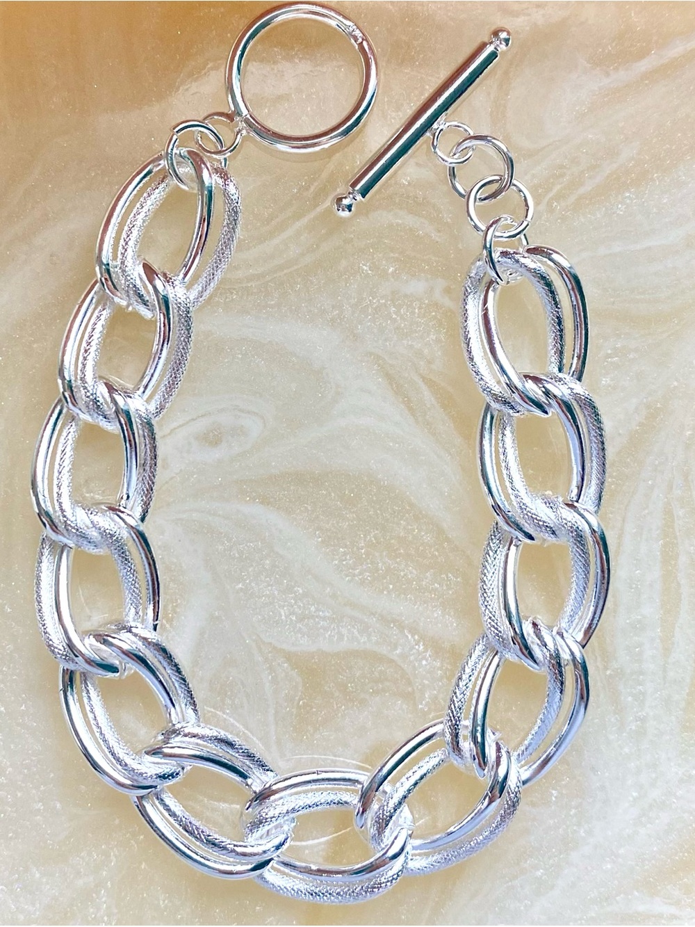 Chunky silver chain link bracelet with toggle clasp